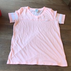 Victoria’s Secret pink shirt.
